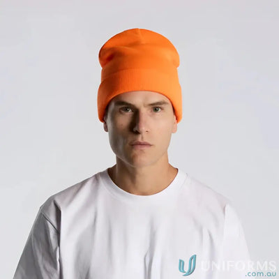 Man wearing high visibility bright orange cuffed beanie with relaxed fit and tight knit