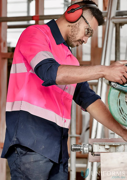 Construction worker using a circular saw in HiVis Segmented Tape L/S Shirt outdoor workwear