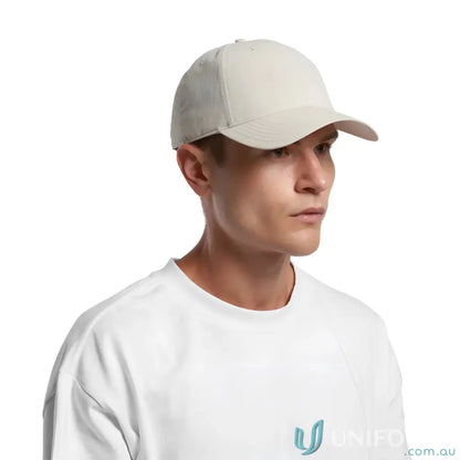 Man wearing Icon Nylon Cap 1142 with curved peak and tonal under-peak lining