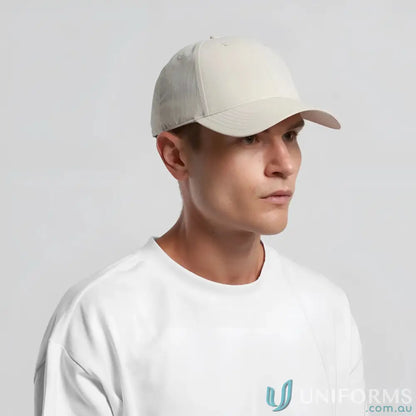 Man wearing Icon Nylon Cap 1142 with curved peak and tonal under-peak lining