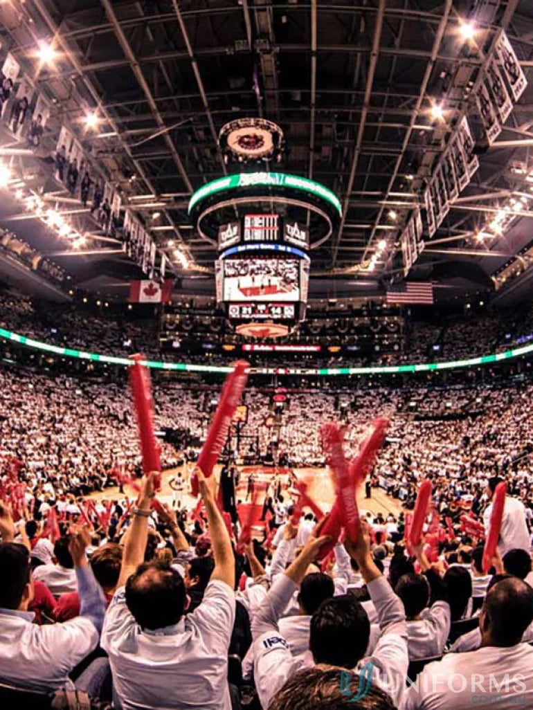 Inflatable bang bang sticks at a crowded basketball arena for fun cheering effects