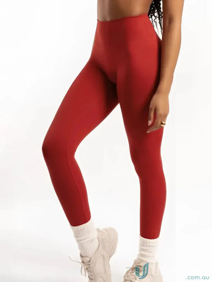 Red high-waisted leggings with invisible scrunch for stylish uniforms and workwear