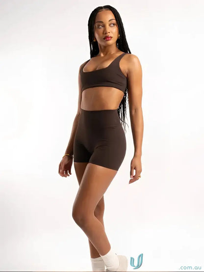 Brown athletic bra and shorts set with invisible scrunch detail for workout uniforms
