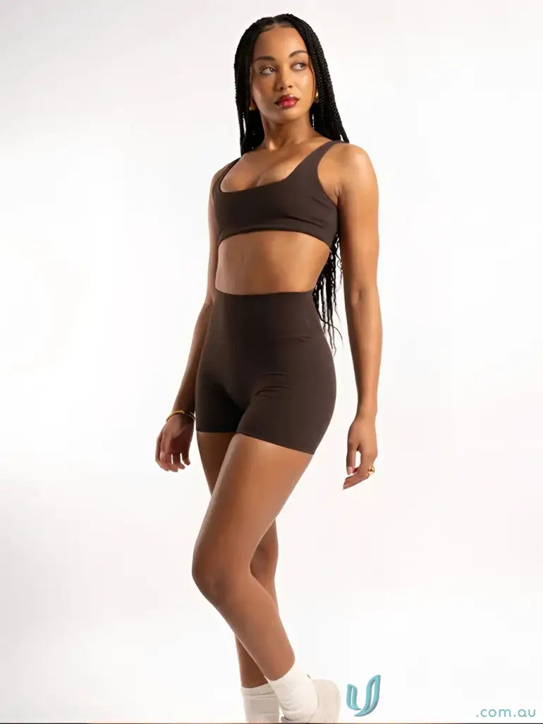 Brown athletic bra and shorts set with invisible scrunch detail for workout uniforms