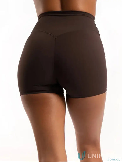 Brown high-waisted athletic shorts with invisible scrunch for uniforms and workwear