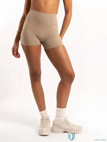 Tan athletic shorts and sneakers from Invicible Scrunch Latte Shorts, perfect for workwear and uniforms