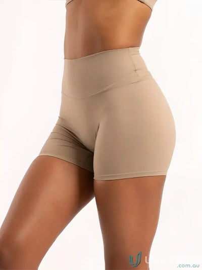 Tan high-waisted athletic shorts from Invicible Scrunch Latte Shorts with invisible scrunch style