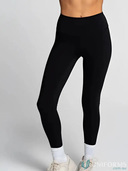 Invisible Scrunch Onyx Leggings paired with white socks and sneakers for casual wear