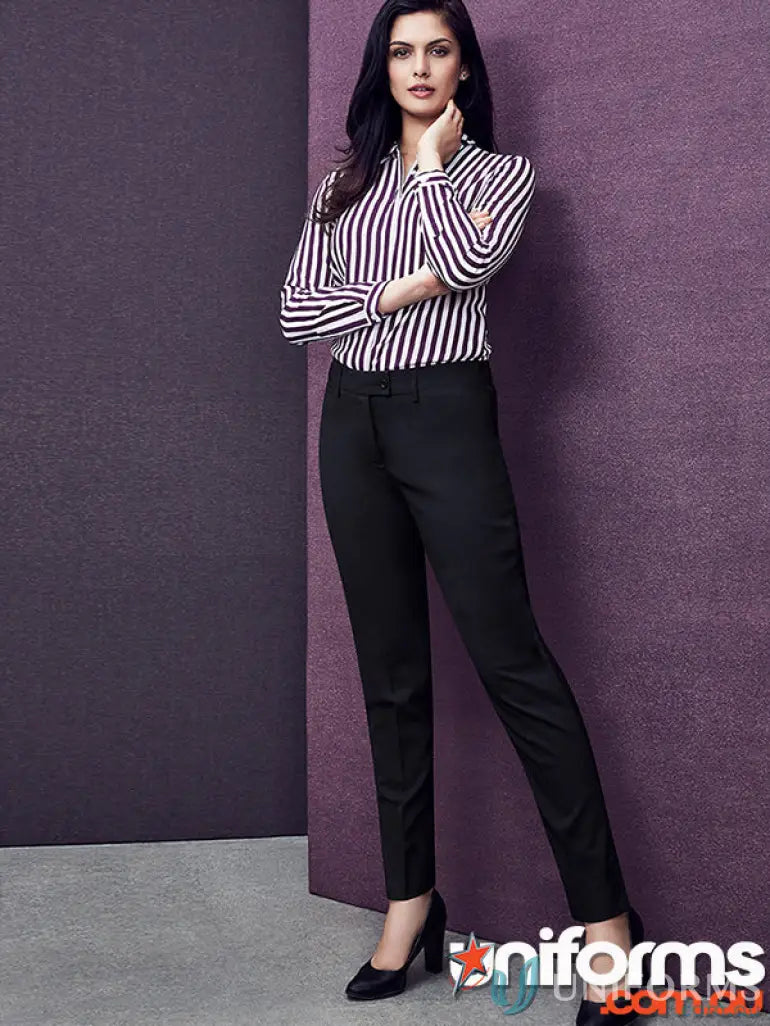 Woman wearing black and white striped slim leg pant made of comfort wool stretch