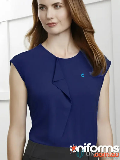 Woman wearing dark blue jersey knit IOP Ladies Pleat Knit Top workwear uniform