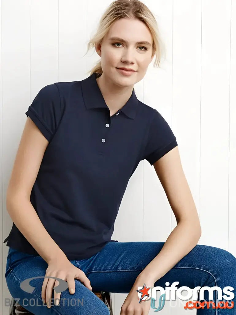 Woman in dark blue IOP EMB Ladies Polo, modern fit uniforms, p2125 ladies modern