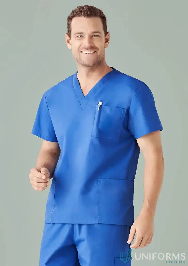 Smiling man in royal blue IOP EMB Unisex Scrub Top, perfect workwear for uniforms