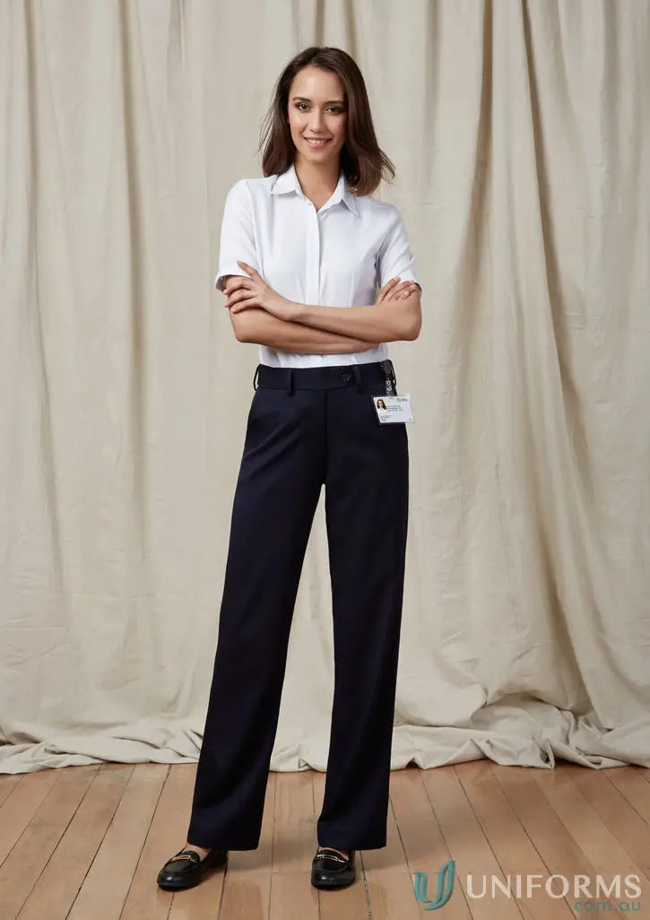 Woman’s navy blue IOP Ladies Flexi Band Pant showcasing comfy biz flexi-band™ design
