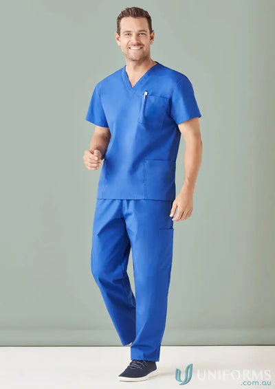 Male model in royal blue IOP Unisex Cargo Scrub Pant with zip pocket and style features two
