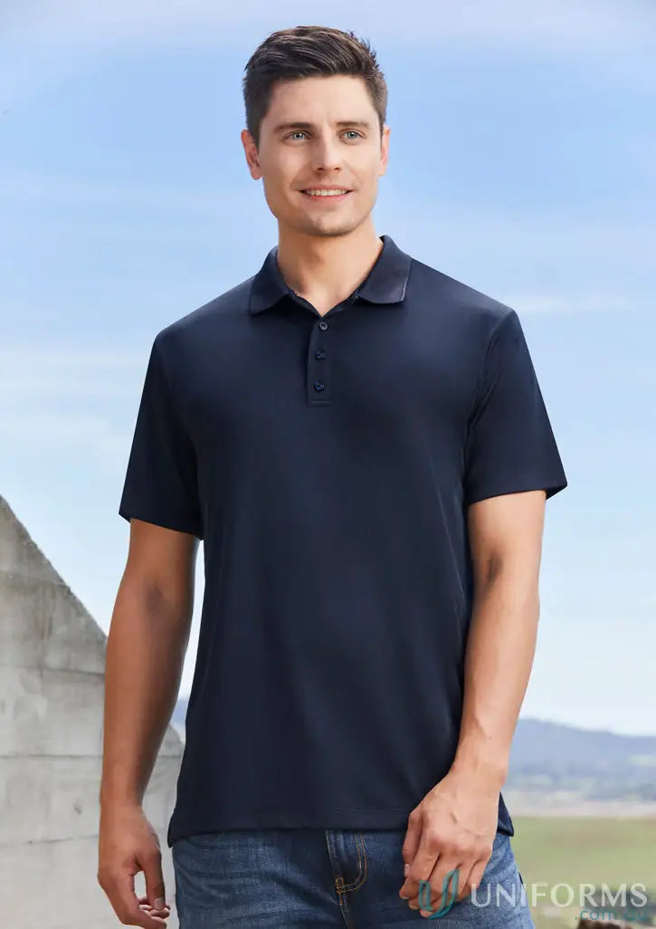 Man in navy blue EMB Mens Polo shirt and jeans for Jani-King EMB Mens Polo