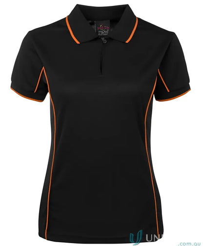 Black JB’s Ladies Podium piping polo 7LPI with orange trim, stay cool in style