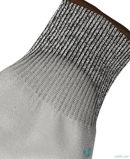 Black and white patterned knit sock with brown cuff, perfect for handling uniforms and cut resistance