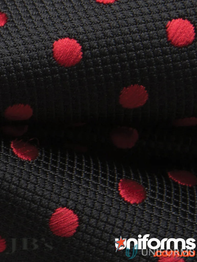Black fabric with red polka dots for JBs Waiting Bow Tie, perfect for uniforms or workwear