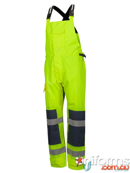 High-visibility lime green bib overalls with reflective tape and knee pad pockets for JB’s Waterproof Bib and Brace