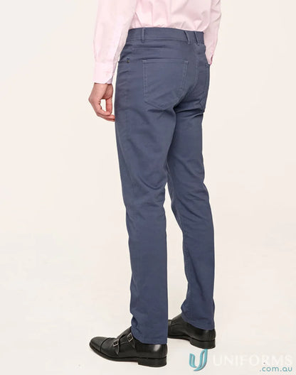 Man wearing jean style flexi chino pants with jacquard weave and black shoes
