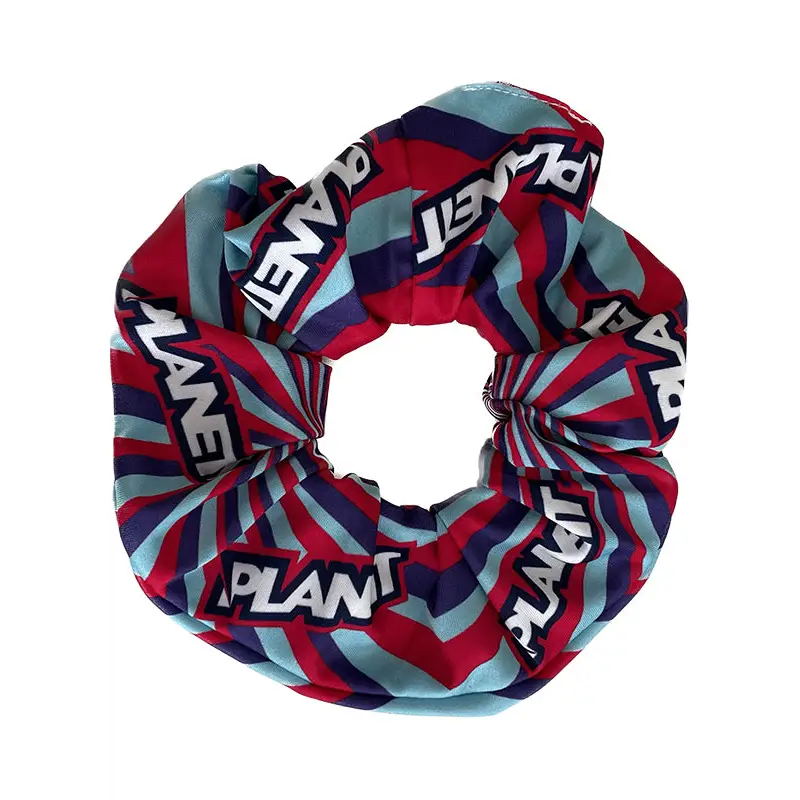 Jelly scrunchie with red navy blue and teal stripes and bold white plant print perfect for work uniforms and workwear