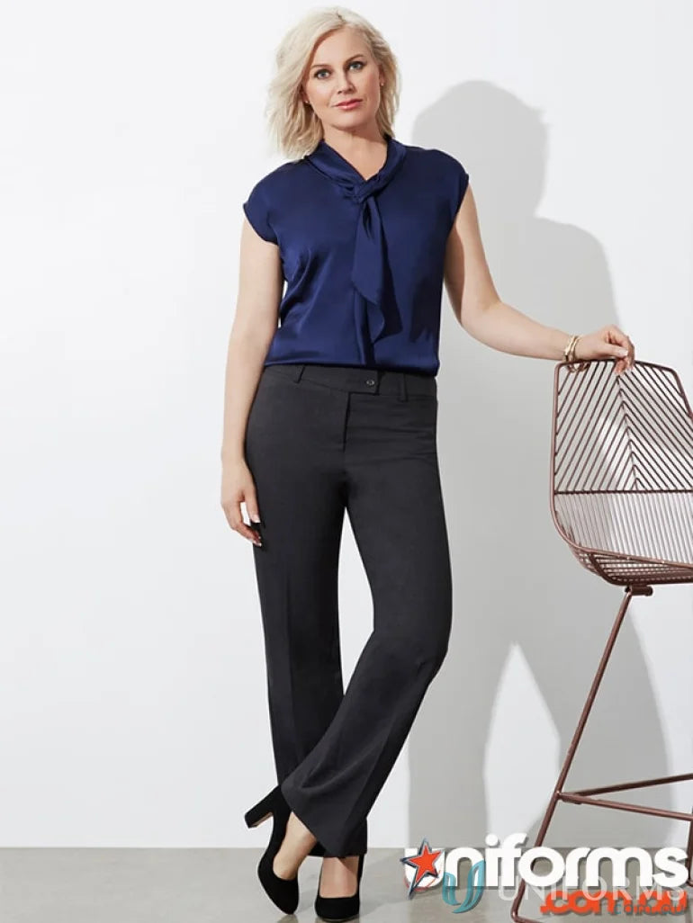 Elegant lady in navy blouse and black pants, perfect for ladies regular fit work uniforms
