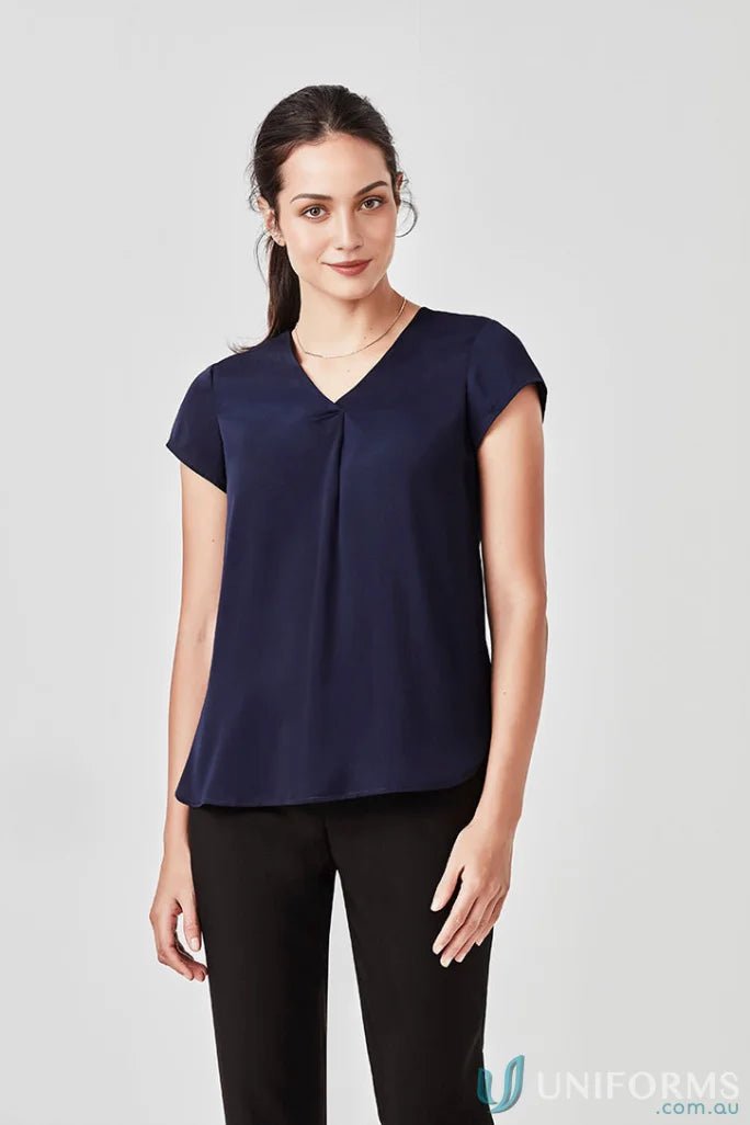 Woman wearing Kayla V-Neck Pleat Blouse in navy with black pants from Biz Collection rb967ls