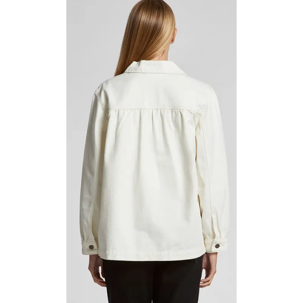 Keely denim jacket styled as white blouse with ruffled hem and button-down front