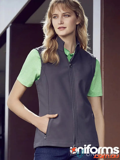 Woman’s gray zip-up vest from KENNARDS Ladies Softshell Vest for added warmth and workwear