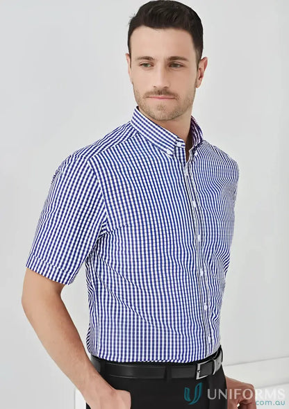 Man in blue and white checkered shirt making work look stylish in KENNARDS Mens Check SS Shirt