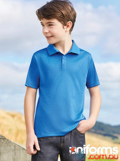 Boy wearing Kids Action Polo in breathable sports knit, perfect for school uniforms