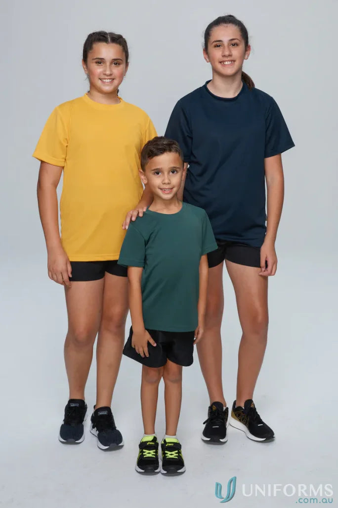 Three kids wearing fun kids botany tee athletic outfits for active play