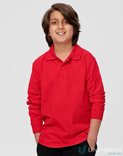 Boy in red long sleeve polo shirt from Kids Pique LS Polo, made of traditional poly cotton