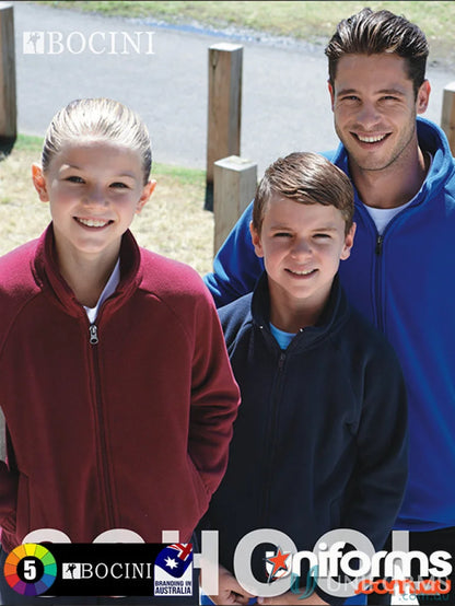 Three kids wearing colorful kids polar fleece zip through jackets outdoors