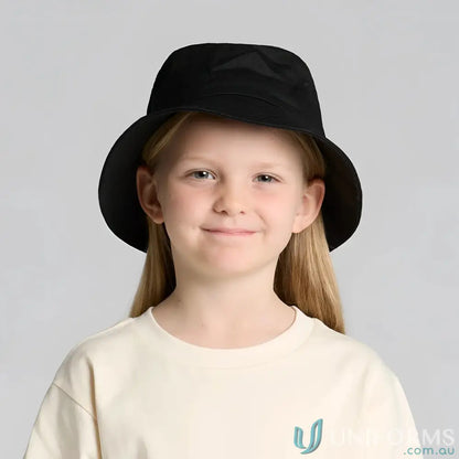 Cute girl in a black bucket hat and cream t-shirt, perfect for kids’ uniforms