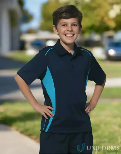Smiling boy in navy and light blue Kids Pursuit Polo shirt for kids pursuit polo style
