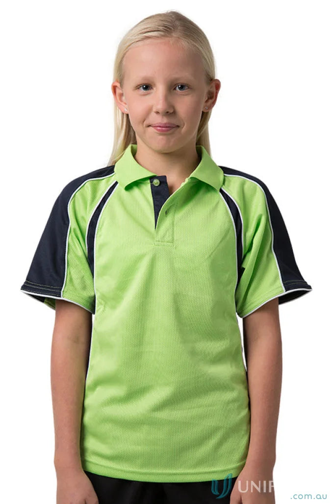 Girl in Kids Rozella Polo wearing a green and navy shirt with CoolDry moisture tech