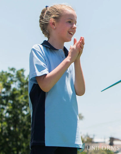 Young girl in Kids Team Mate Polo clapping, stylish ps73k Teammate Polo shirt