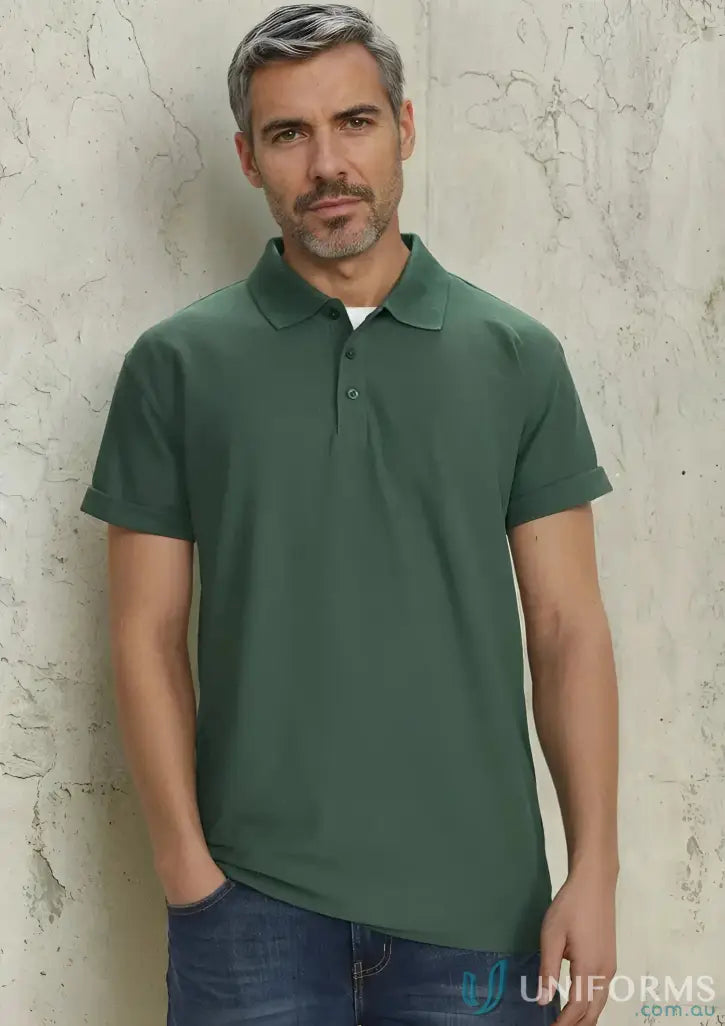 Man in green Krue Polo with short sleeve design and durable top-stitched armholes