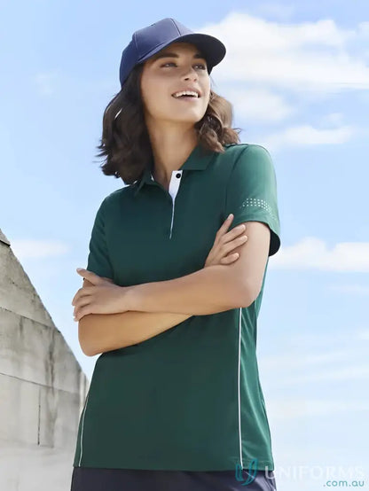 Woman in green Ladies Balance Polo with biz cool™ technology and P200LS branding