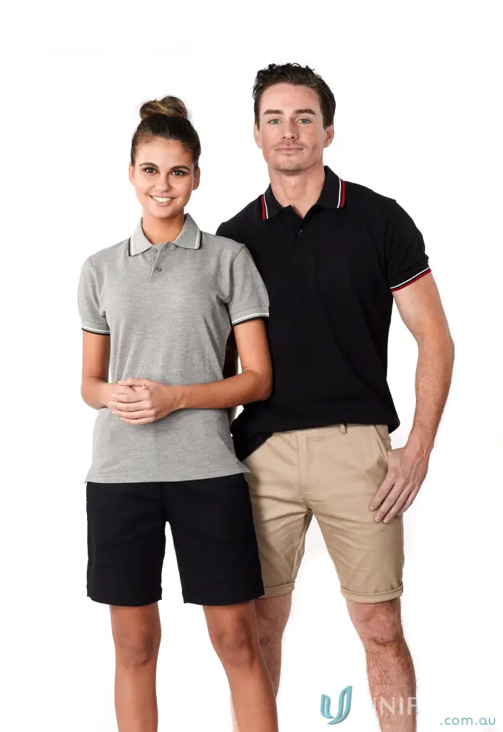 Two people modeling Ladies Bobby Polo shirts and shorts for a casual look