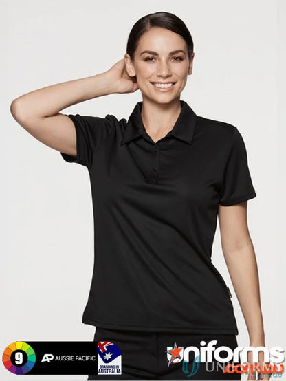 Smiling woman in black fabric Ladies Botany Polo, perfect for uniforms and workwear