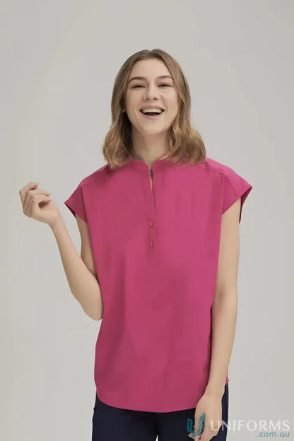 Woman in pink blouse wearing Ladies Chrissy Drop Shoulder from City Collection Ladies