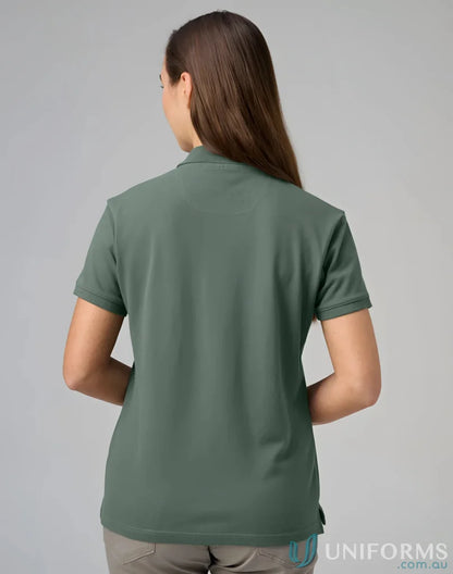 Woman’s green polo shirt from PS56 Darling Harbour with a winning spirit ladies vibe