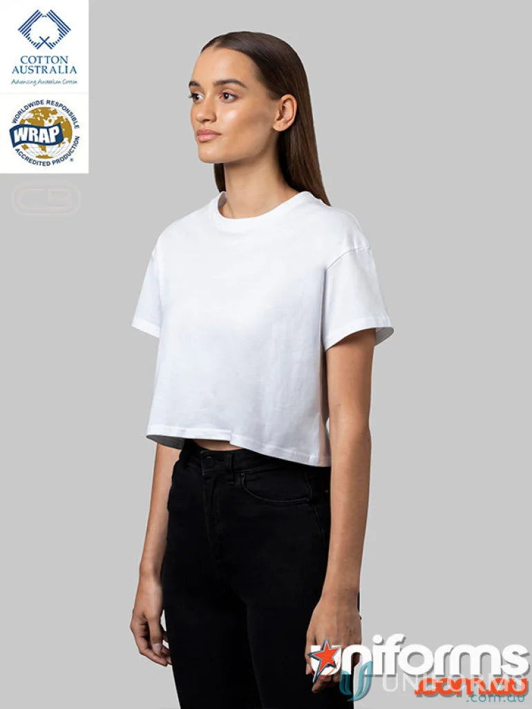 Woman modeling a plain white Ladies Crop Tee, perfect for casual uniforms or measuring length