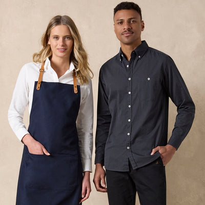 Ladies Floyd long sleeve linen cotton shirt with navy blue apron and tan leather straps