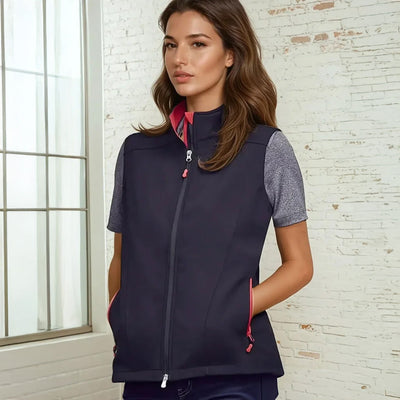 Ladies Gainsford Softshell Vest in navy blue with pink zipper and gray mesh sleeves from womens Geneva collection