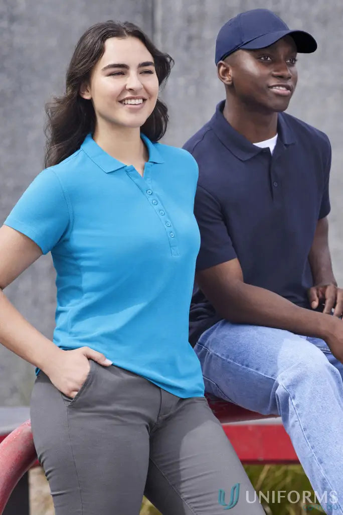 Lady in blue Krue Polo and guy in navy Talon Polo showing off workwear game