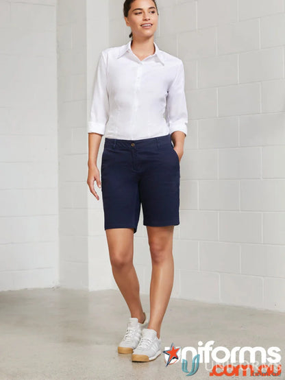 Woman wearing navy Lawson Chino Short from BS021L Biz Collection, perfect for casual style