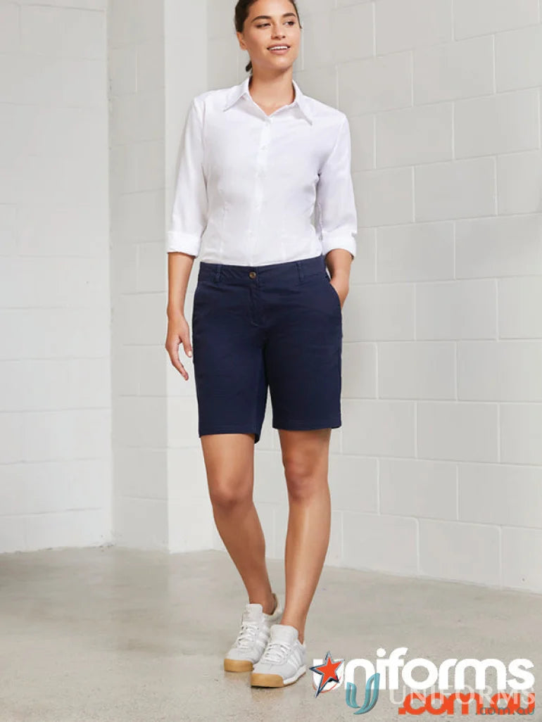 Woman wearing navy Lawson Chino Short from BS021L Biz Collection, perfect for casual style